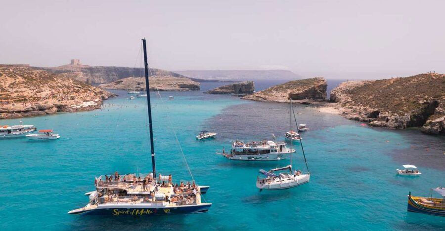 Comino: Blue Lagoon Catamaran Cruise with Lunch and Open Bar - Swimming from the boat near the Blue Lagoon