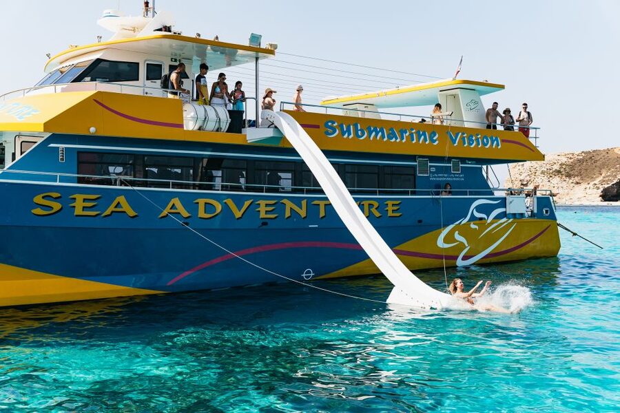 Comino: Blue Lagoon, Crystal Lagoon, and Seacaves Tour - The waterslide, ladders, and underwater windows
