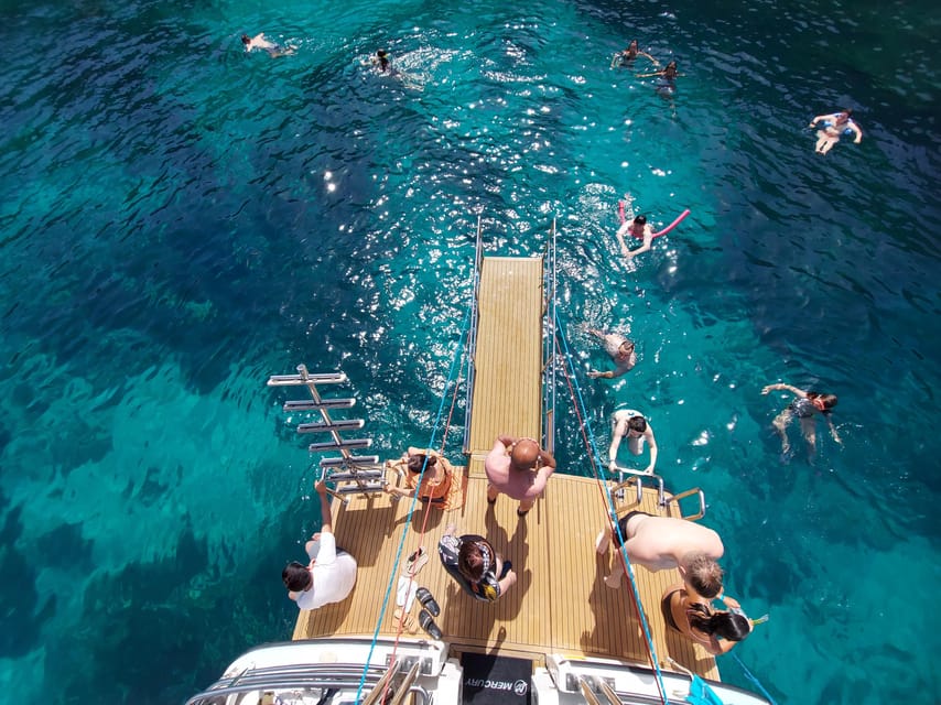 From Mellieha: Three Bay Cruise including the Blue Lagoon - Blue Lagoon: beautiful water, busy shore