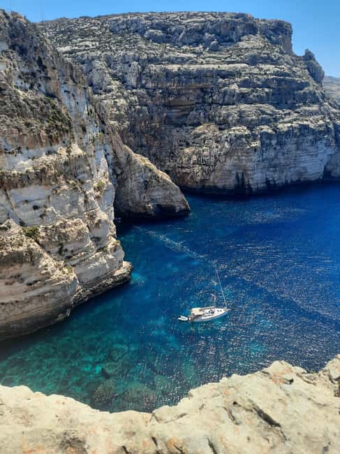 From Sliema: Blue Grotto Trip - Including Boat Cave Tour - Entering the caves by small boat