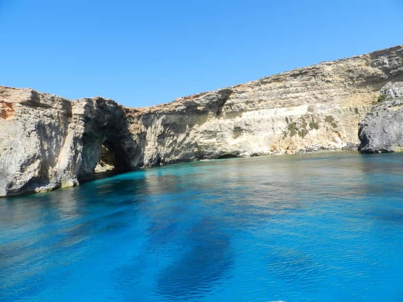 From Sliema: Comino, Crystal Lagoon, and Blue Lagoon Cruise - Blue Lagoon: beautiful water, busy shore