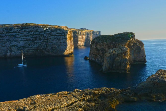 Gozo island guided day tour from Malta - Xlendi Beach brings cliffs and caves