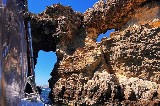 Half Day Malta Tour to Gozo Comino and Blue Lagoon Caves - Gozo Harbour and San Niklaw Bay from the water