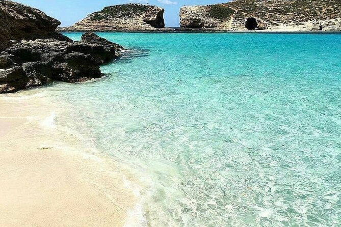 Malta Sunset Boat Tour: Bugibba to Comino Blue Lagoon Cruise - The 10-meter slide and swimming from the boat