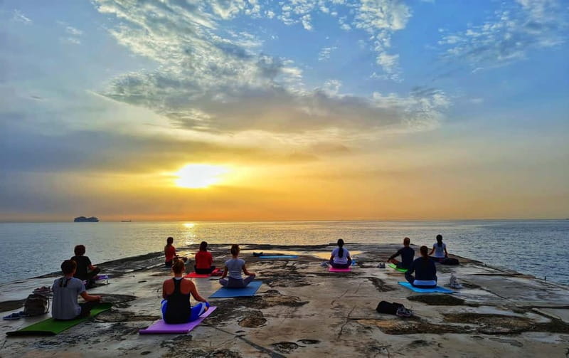 Sliema: Beach Yoga Class with Swimming - Sunrise or sunset: choosing the better session