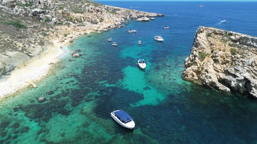 Sliema: Boat Trip to Comino Blue Lagoon, Gozo, and Caves - The Gozo swim near Ħalfa Rock